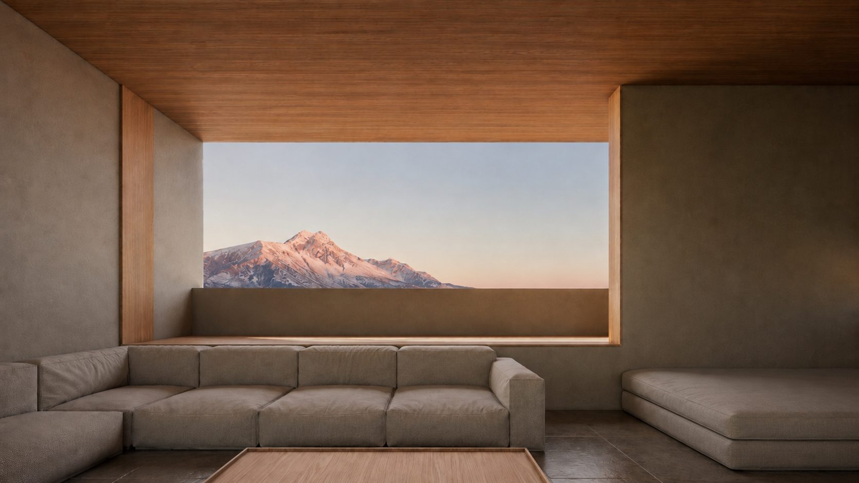 A sofa beside a window framing the mountain